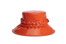 Load image into Gallery viewer, A glossy orange bucket hat with a wide brim and a braided orange band around the crown, shown on a plain white background. Front