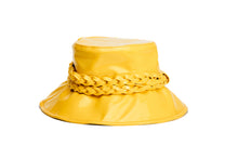 Load image into Gallery viewer, A bright yellow glossy bucket hat featuring a wide brim and a thick braided rope detail wrapped around the crown, shown against a plain white background. Front