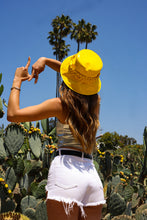 Load image into Gallery viewer, Girl wearing the yellow bucket hat making the LA sign