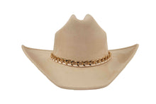 Load image into Gallery viewer, A light beige cowboy hat with a wide, chunky gold chain link band around the crown, shown against a plain white background.