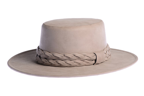 Smokey grey hue cordobes hat made of vegan leather and finished with a statement double braid, left side view