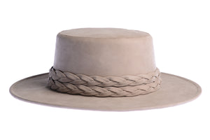 Smokey grey hue cordobes hat made of vegan leather and finished with a statement double braid, right side view
