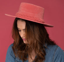 Load image into Gallery viewer, Girl wearing a cordobes hat made of vibrant pink felt
