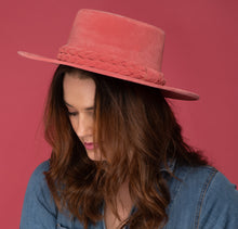 Load image into Gallery viewer, Girl wearing a cordobes hat made of vibrant pink felt