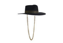 Load image into Gallery viewer, Black hat composed of the finest wool, it has an elegant structured crown, finished with a studded trim that defines the body of the hat. It comes with a detachable gold chain, right side view