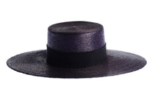 Load image into Gallery viewer, A black woven straw boater hat with a wide brim and a black ribbon band, shown against a plain white background. Side