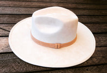 Load image into Gallery viewer, Suede hat with the crown shaped into a clean and ridged design with a double synthetic suede tan trim, left side view