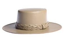 Load image into Gallery viewer, Cordobes hat in tan color crafted with an innovative metallic vegan leather made from nopal, finished with double braided trim, left side view
