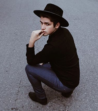 Load image into Gallery viewer, Boy posing in the street with a hat swathed in rich black velour fabric
