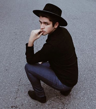 Load image into Gallery viewer, Boy posing in the street with a hat swathed in rich black velour fabric