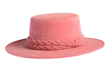 Load image into Gallery viewer, Cordobes hat composed of vibrant pink felt and with a statement double braid, left side view
