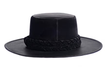 Load image into Gallery viewer, Hat swathed in rich black velour fabric and a brim made of black synthetic leather with a double braid velour trim, back view