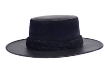 Load image into Gallery viewer, Hat swathed in rich black velour fabric and a brim made of black synthetic leather with a double braid velour trim, left side view