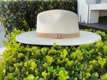 Load image into Gallery viewer, Suede hat with the crown shaped into a clean and ridged design with a double synthetic suede tan trim, left side view
