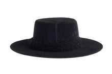 Load image into Gallery viewer, Cordobes hat composed of soft velour fabric in deep black with a matching statement double braid, back view