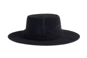 Cordobes hat composed of soft velour fabric in deep black with a matching statement double braid, back view
