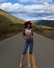 Load image into Gallery viewer, Red western hat in the middle of the road 
