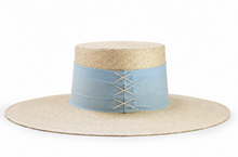 Load image into Gallery viewer, A straw boater-style hat with a light blue fabric band around the crown and decorative lacing.
