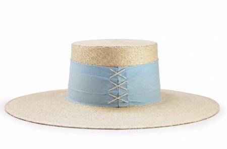 A straw boater-style hat with a light blue fabric band around the crown and decorative lacing.