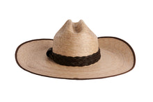 Load image into Gallery viewer, A natural straw cowboy hat with a dark brown braided band, shown from a side angle on a plain white background.
