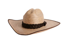 Load image into Gallery viewer, A natural straw cowboy hat with a dark brown braided band, shown from a side angle on a plain white background.
