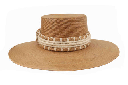 Darker straw hat with decorative band 