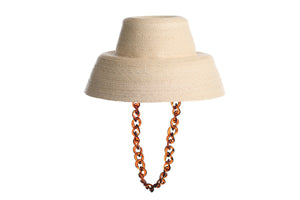 Straw hat bucket shape in natural color made of palm leaves finished with a detachable chain, right side view