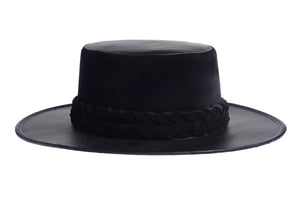 Hat swathed in rich black velour fabric and a brim made of black synthetic leather with a double braid velour trim, right side view