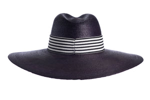 Straw wide palma hat made with palm leaves and finished with a cotton striped trim, back view