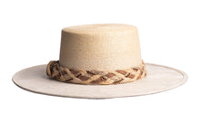 Load image into Gallery viewer, Straw hat in natural color made with palm leaves and the brim is made of structured suede finished with a combination braided trim, back view
