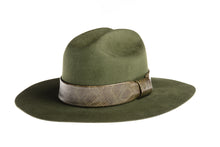 Load image into Gallery viewer, Hat made of fine olive green wool, this consists of a stiffened double-peak crown and ironed wide brim which is complemented by a faux snakeskin trim, left side view

