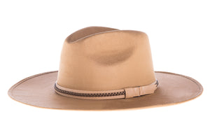 Suede hat shaped into a clean and ridged design with double bound synthetic suede and braided trim, left side view