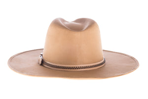 Suede hat shaped into a clean and ridged design with double bound synthetic suede and braided trim, back view
