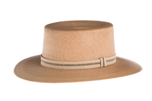 Load image into Gallery viewer, Straw hat made of Palm leaf in a natural color finished with an embroidered trim, left side view
