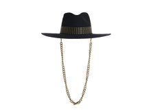 Load image into Gallery viewer, Black hat composed of the finest wool, it has an elegant structured crown, finished with a studded trim that defines the body of the hat. It comes with a detachable gold chain, front view
