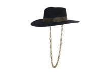 Load image into Gallery viewer, Black hat composed of the finest wool, it has an elegant structured crown, finished with a studded trim that defines the body of the hat. It comes with a detachable gold chain, left side view
