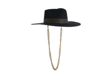 Load image into Gallery viewer, Black hat composed of the finest wool, it has an elegant structured crown, finished with a studded trim that defines the body of the hat. It comes with a detachable gold chain, right side view
