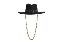 Load image into Gallery viewer, Black hat composed of the finest wool, it has an elegant structured crown, finished with a studded trim that defines the body of the hat. It comes with a detachable gold chain, back view
