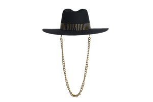 Black hat composed of the finest wool, it has an elegant structured crown, finished with a studded trim that defines the body of the hat. It comes with a detachable gold chain, back view