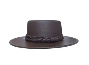  Hat influence from the classic Spanish boater, made of Tabacco faux leather and complemented by a double braid, front view