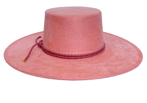 Vegan suede hat in pink color with a cordobes style and finished with a statement double braid, front view