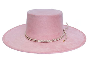 Vegan suede hat in soft pink color, finished with a statement double braid, front view