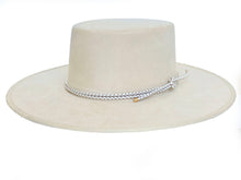 Load image into Gallery viewer, White suede hat with a boater crown and finished with a statement bolo braid, left side view
