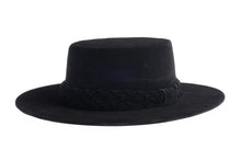 Load image into Gallery viewer, Cordobes hat composed of soft velour fabric in deep black with a matching statement double braid, left side view
