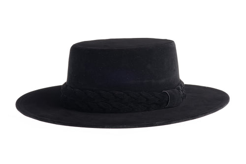 Cordobes hat composed of soft velour fabric in deep black with a matching statement double braid, left side view