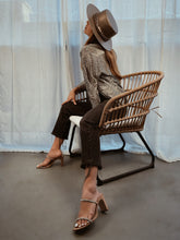 Load image into Gallery viewer, Girl posing in a chair with a cordobes hat in bronze color
