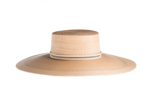 Hat with a flat top crown braid with palm leaves in natural color and an embroidered trim, right side view