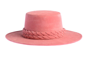 Cordobes hat composed of vibrant pink felt and with a statement double braid, front view