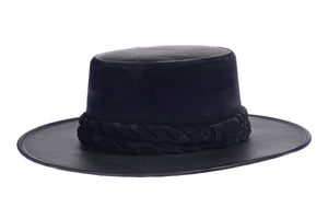 Hat swathed in rich black velour fabric and a brim made of black synthetic leather with a double braid velour trim, left side view