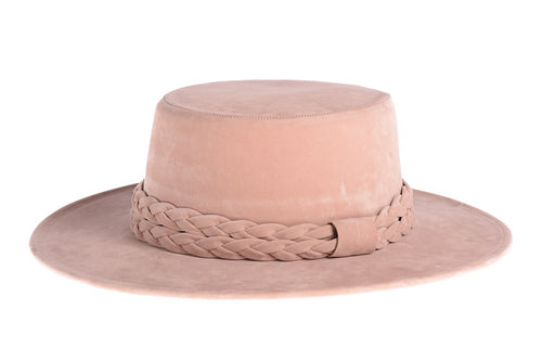 Soft pink hat composed of soft velour fabric with a double braid, left side view